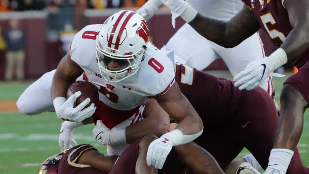 Wisconsin running back Braelon Allen pushing forward against Minnesota in 2021.